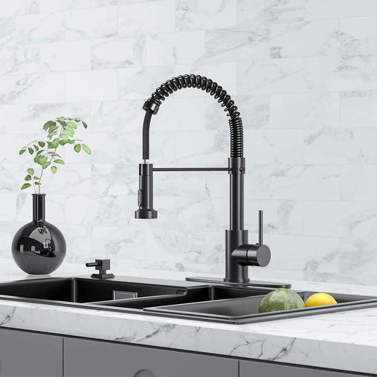 Matte black spring kitchen faucet installed on marble countertop.